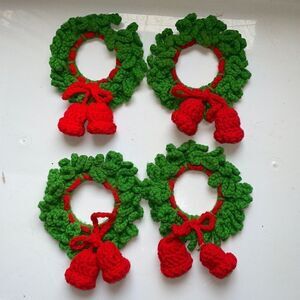 Vtg set of four green crochet yarn wreaths with red bows with bells